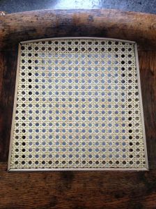 Chair with pre-woven cane seat